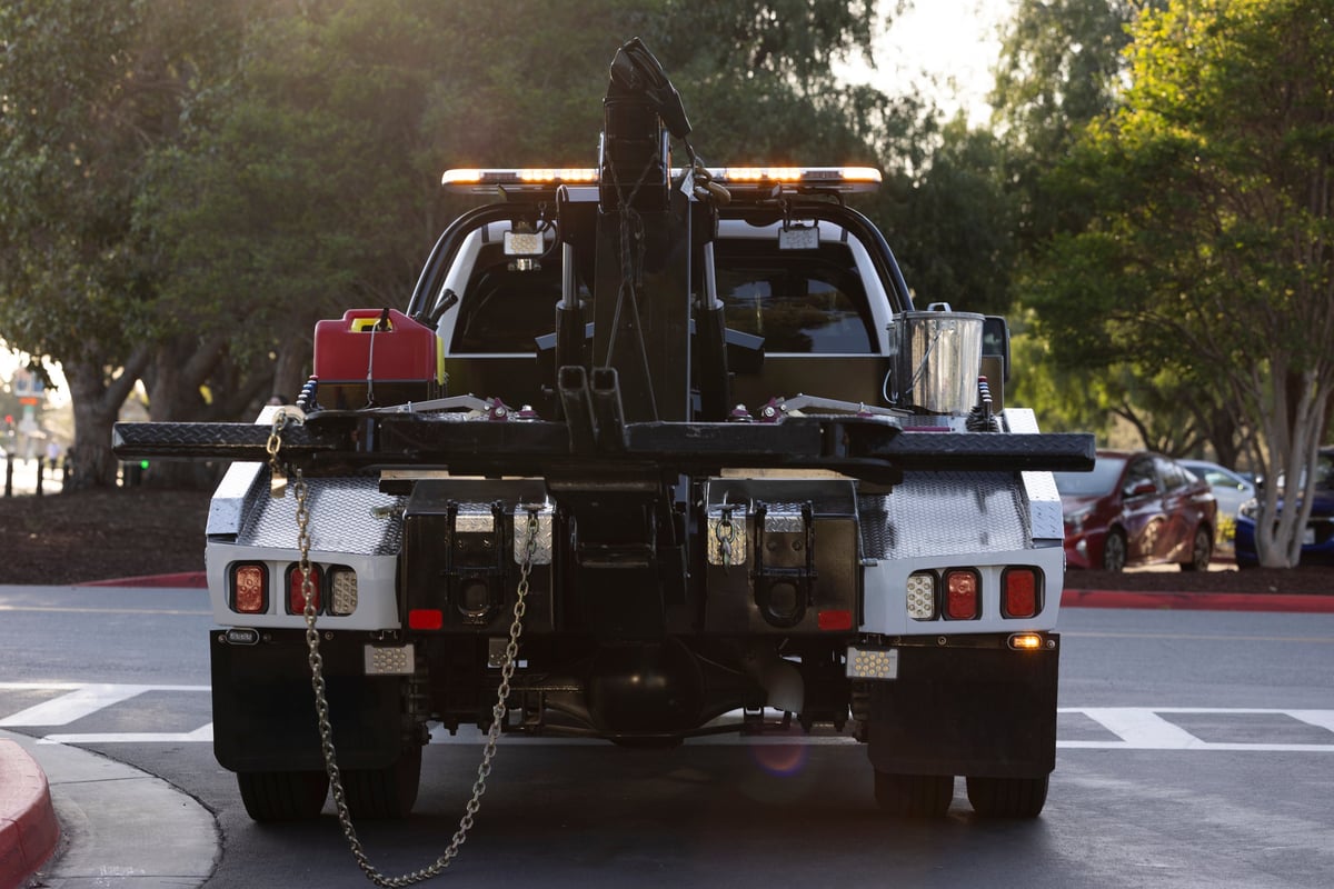 Tow truck on a street at night